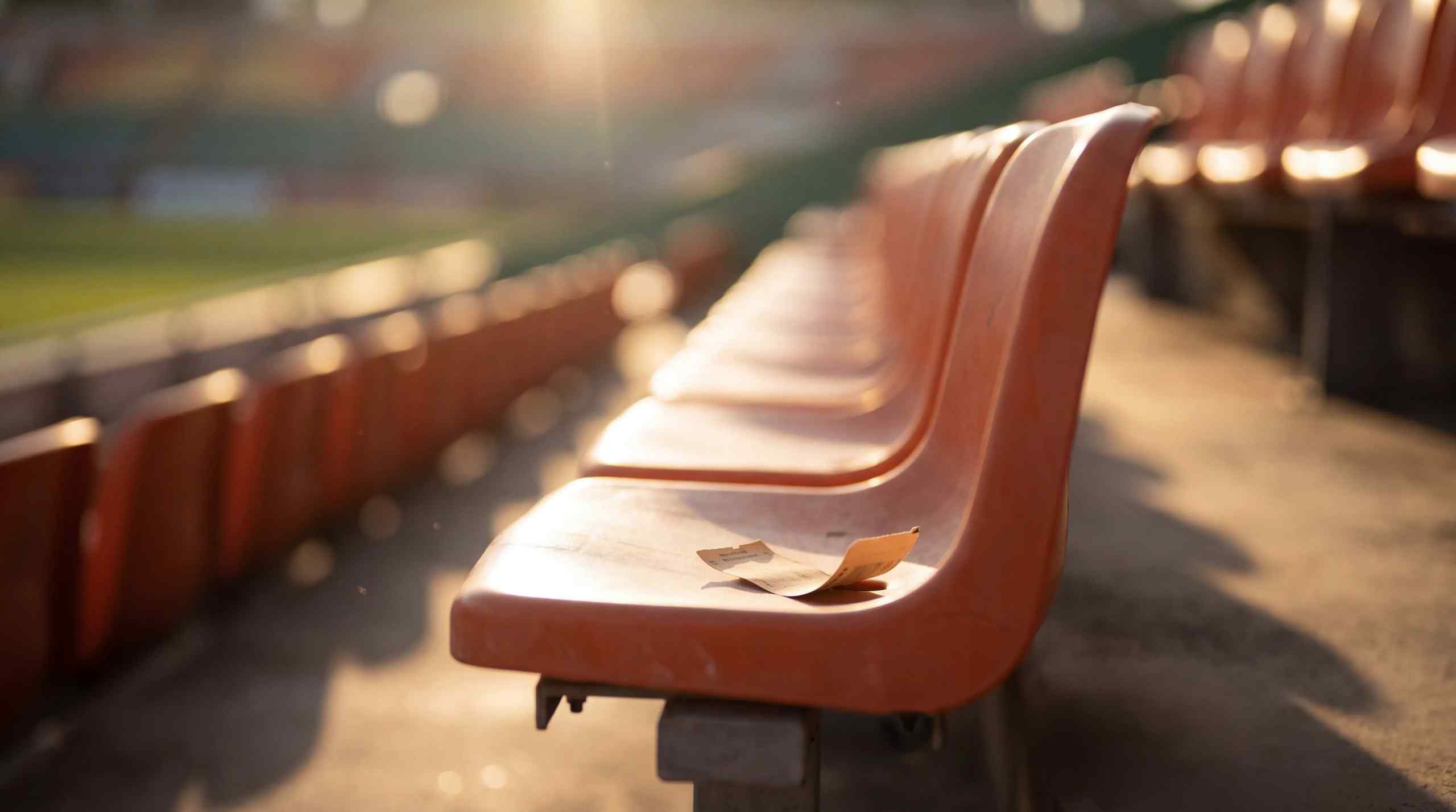 A bet receipt on the bleachers of a sporting event.
